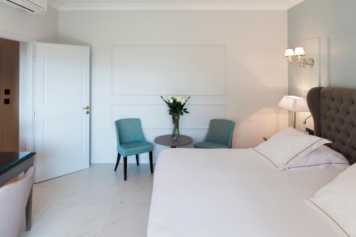 Un ou plusieurs lits dans un hébergement de l'établissement Hotel Les Bories & Spa
