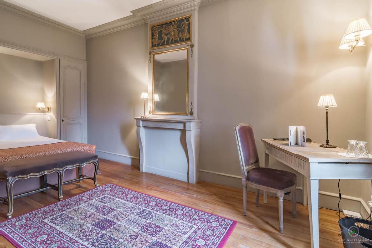 Un ou plusieurs lits dans un hébergement de l'établissement Hôtel Restaurant Spa Le Sauvage