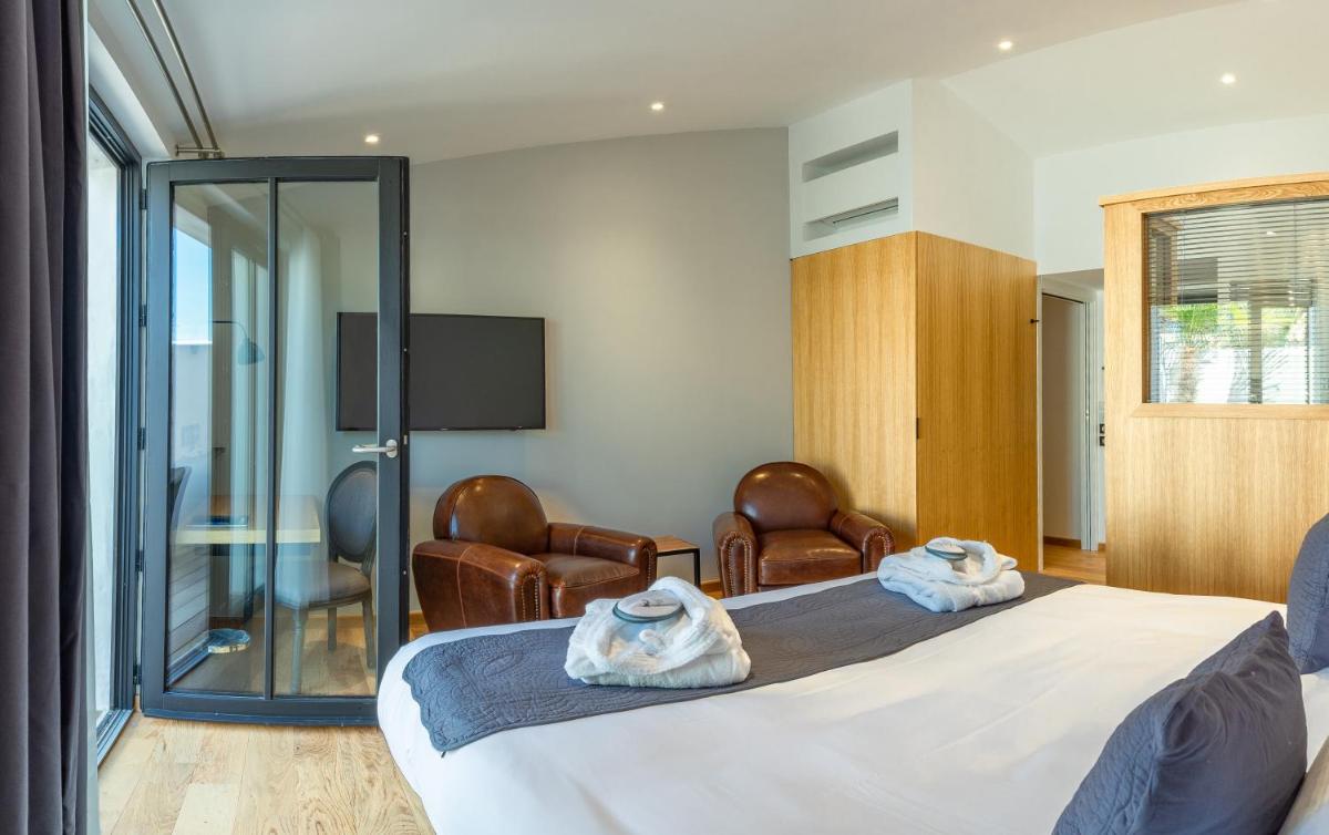 Un ou plusieurs lits dans un hébergement de l'établissement Hôtel Ile de Ré