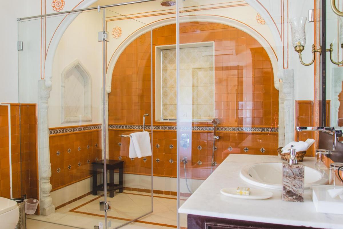 a bathroom with a glass shower and a sink at Royal Heritage Haveli - By Leisure Hotels in Jaipur