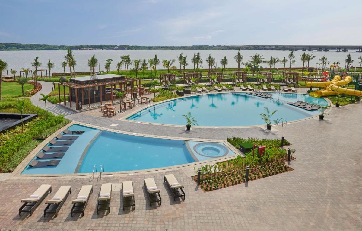 an overhead view of a pool at a resort at Grand Hyatt Kochi Bolgatty in Cochin