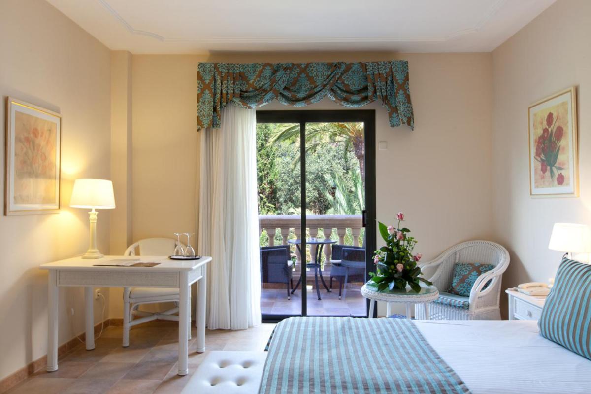 Cama o camas de una habitación en Lago Garden Apart-Suites & Spa Hotel