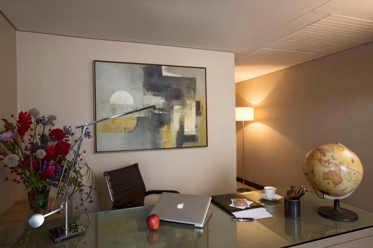 an office with a desk with a laptop on it at Taj Lands End in Mumbai an office with a desk with a laptop on it at Taj Lands End in Mumbai