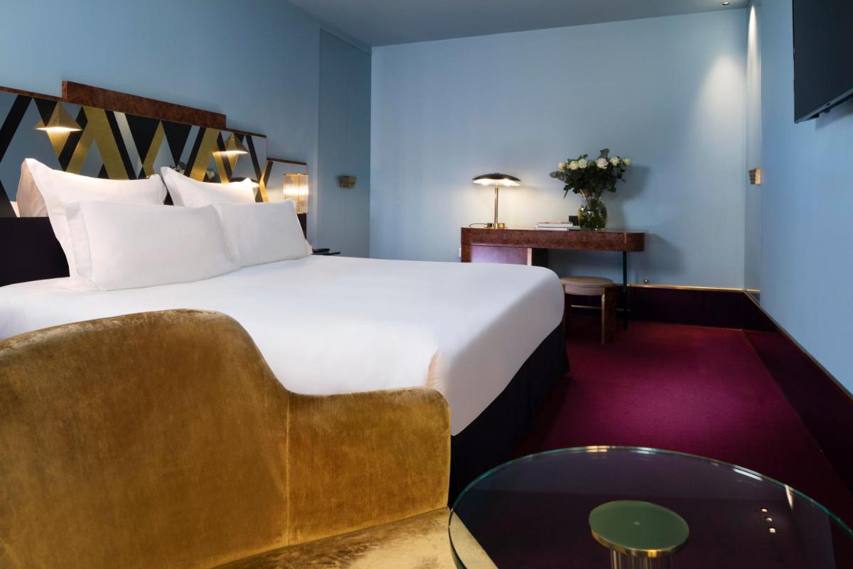 Un ou plusieurs lits dans un hébergement de l'établissement Hôtel Saint-Marc