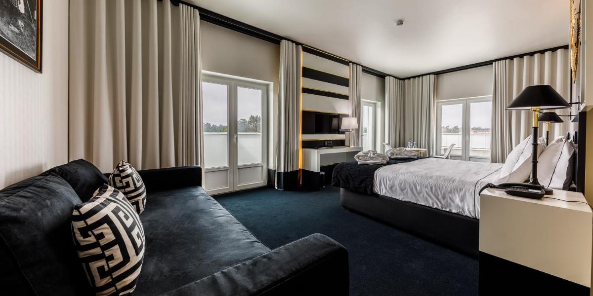 Uma cama ou camas num quarto em Aurea Fatima Hotel Congress & Spa