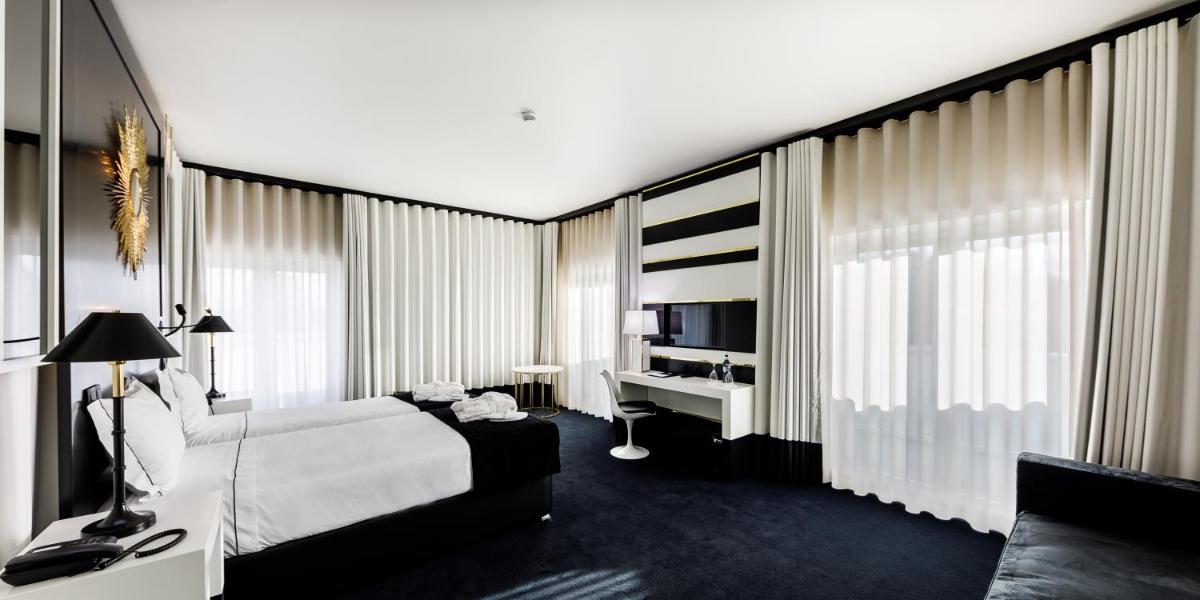 Uma cama ou camas num quarto em Aurea Fatima Hotel Congress & Spa