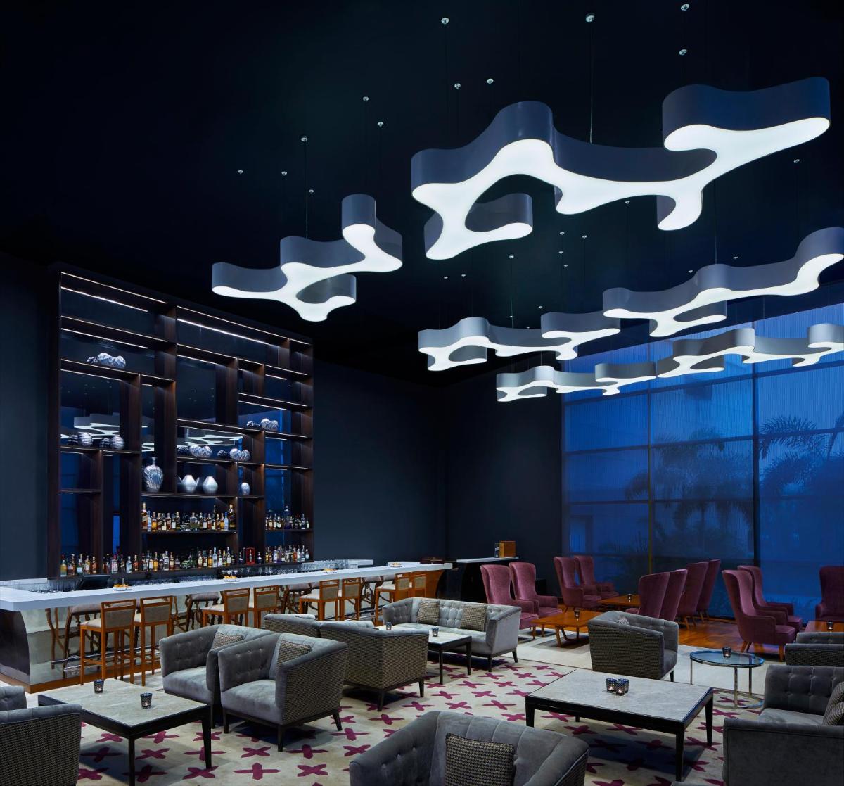 a rendering of a restaurant with tables and chairs at Taj Swarna, Amritsar in Amritsar