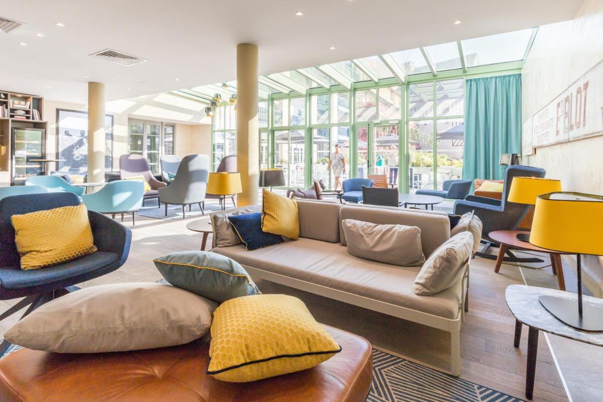 Coin salon dans l'établissement Résidence Pierre & Vacances Premium Presqu'Ile de la Touques