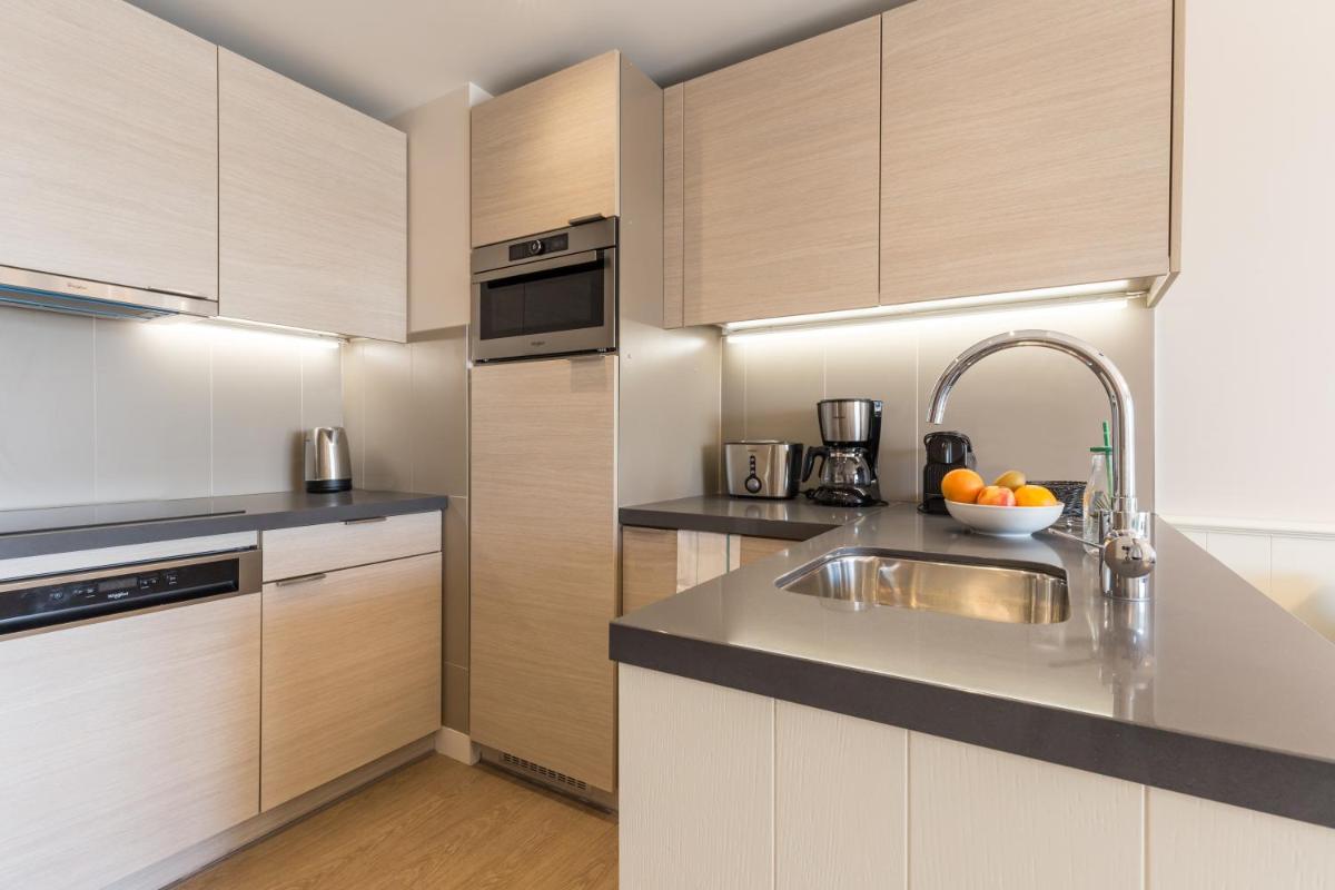 Cuisine ou kitchenette dans l'établissement Résidence Pierre & Vacances Premium Presqu'Ile de la Touques