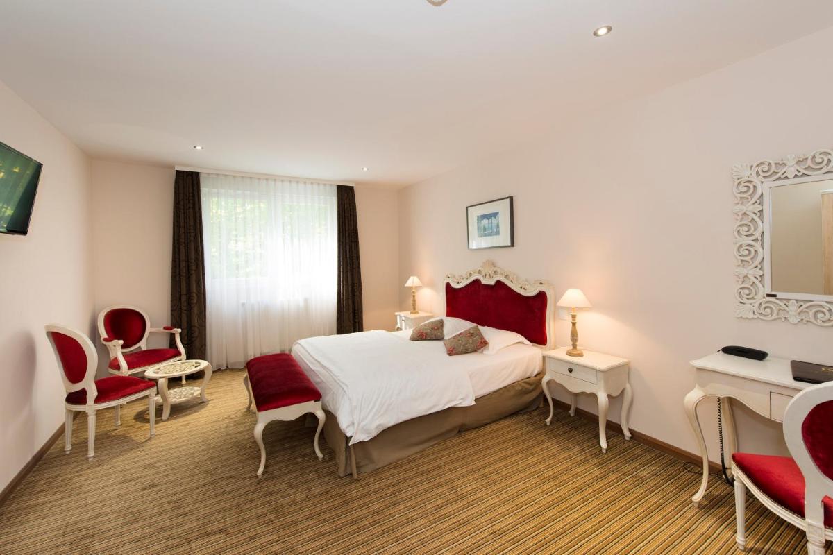 Un ou plusieurs lits dans un hébergement de l'établissement Hôtel du Parc, Restaurant, Spa & Wellness