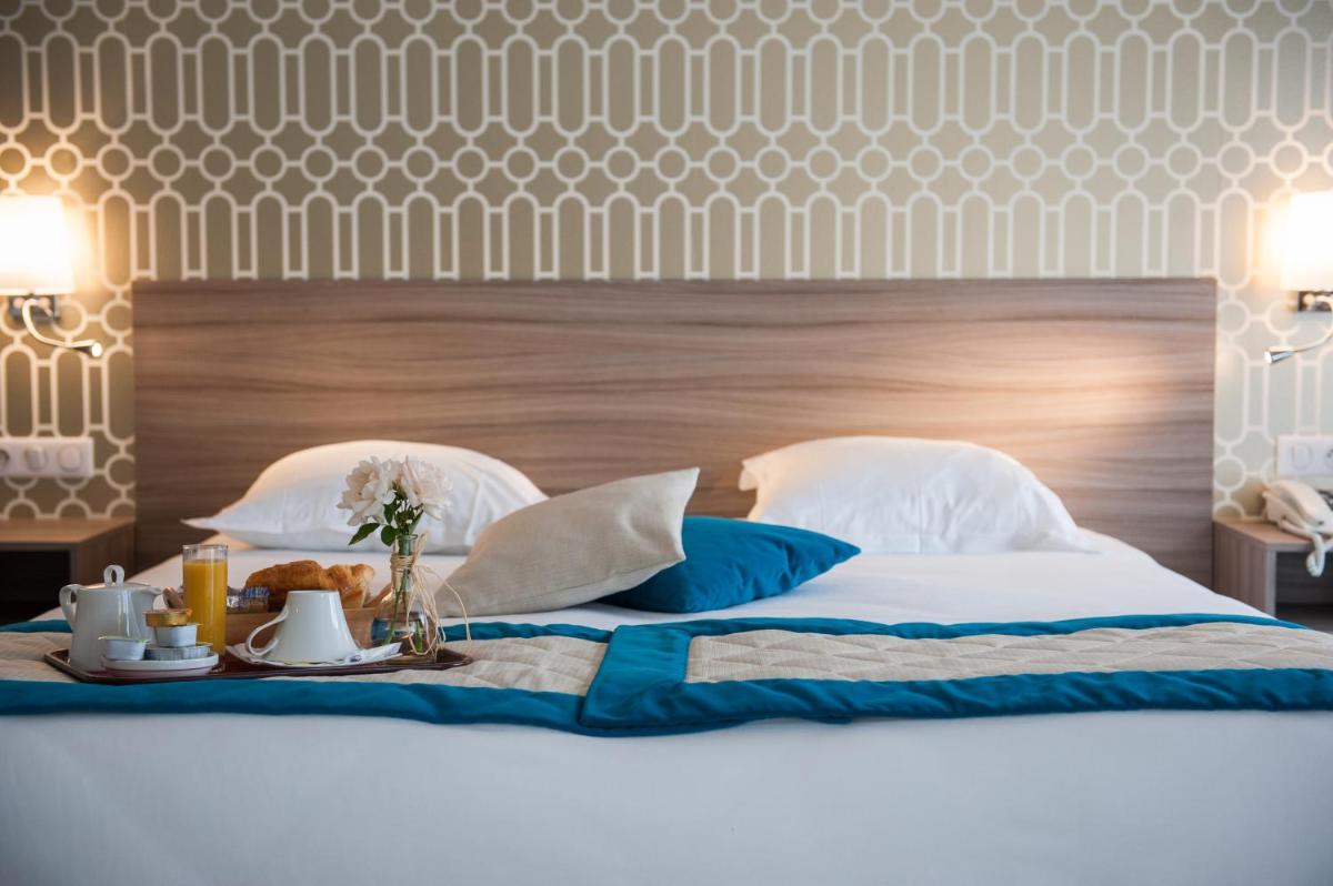 Un ou plusieurs lits dans un hébergement de l'établissement Hotel & Spa Radiana