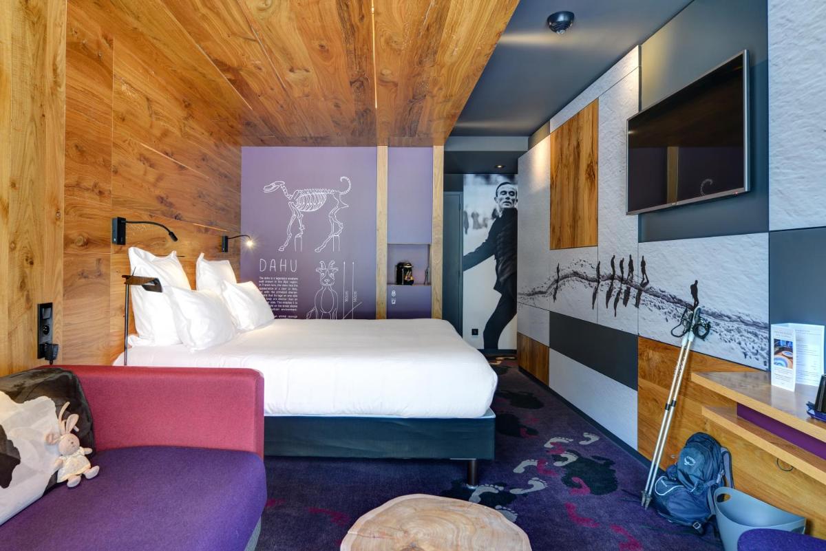 Un ou plusieurs lits dans un hébergement de l'établissement Alpina Eclectic Hotel