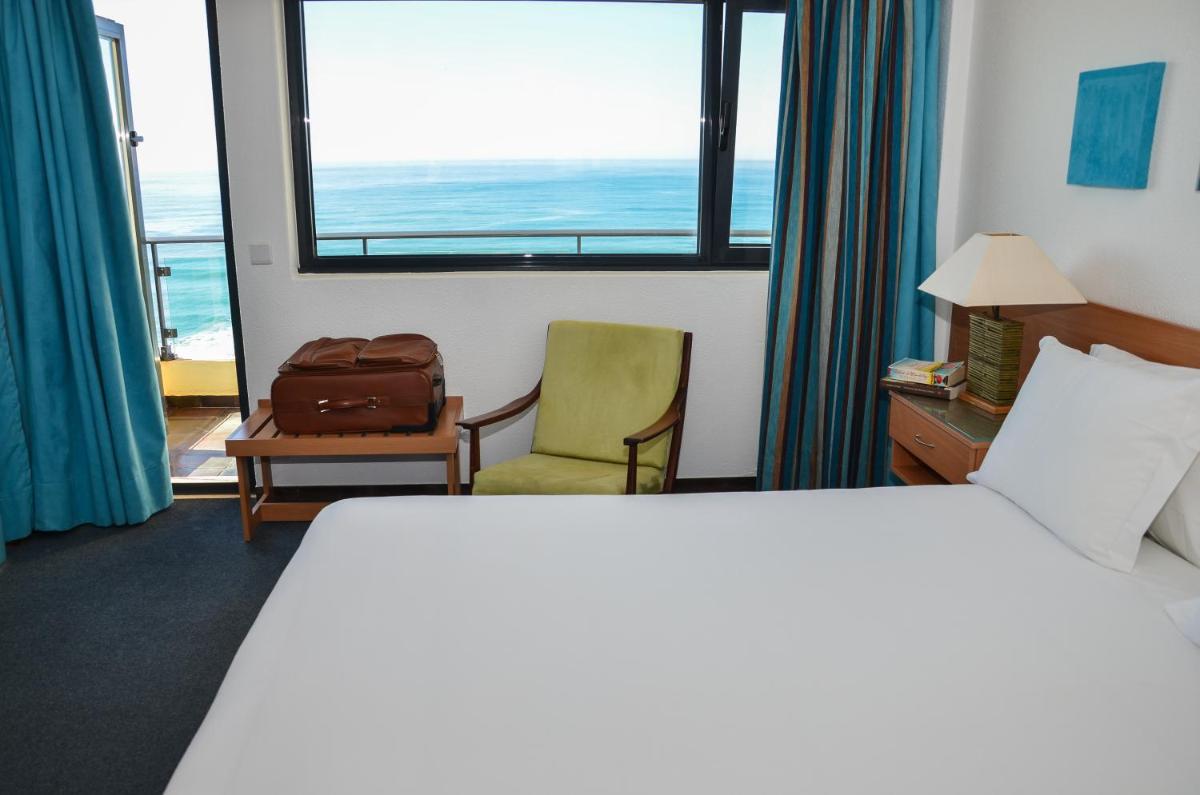 Uma cama ou camas num quarto em Hotel Golf Mar