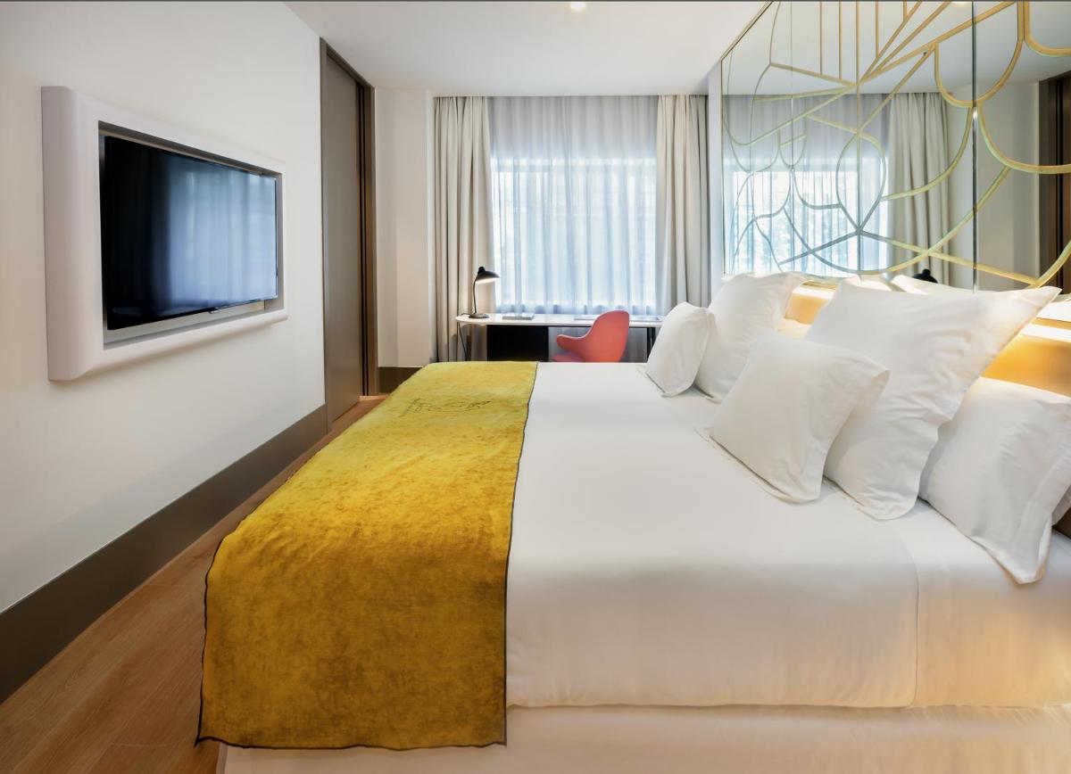Cama o camas de una habitación en Barceló Torre de Madrid