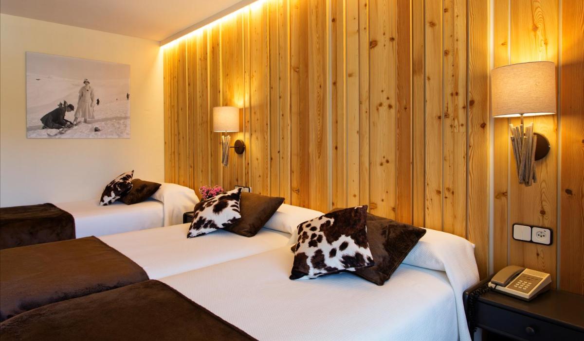 Cama o camas de una habitación en Hotel La Coma