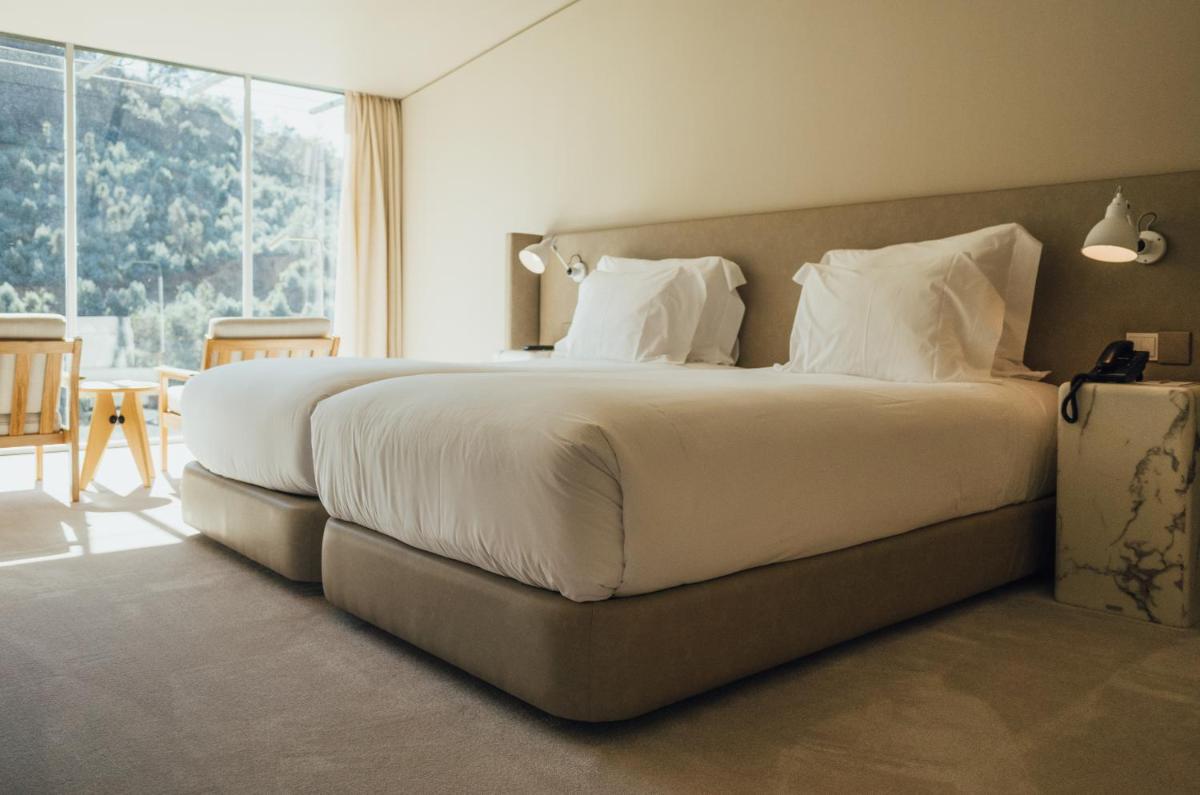 Uma cama ou camas num quarto em Octant Douro