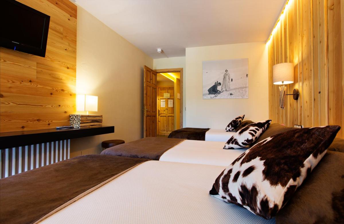 Cama o camas de una habitación en Hotel La Coma