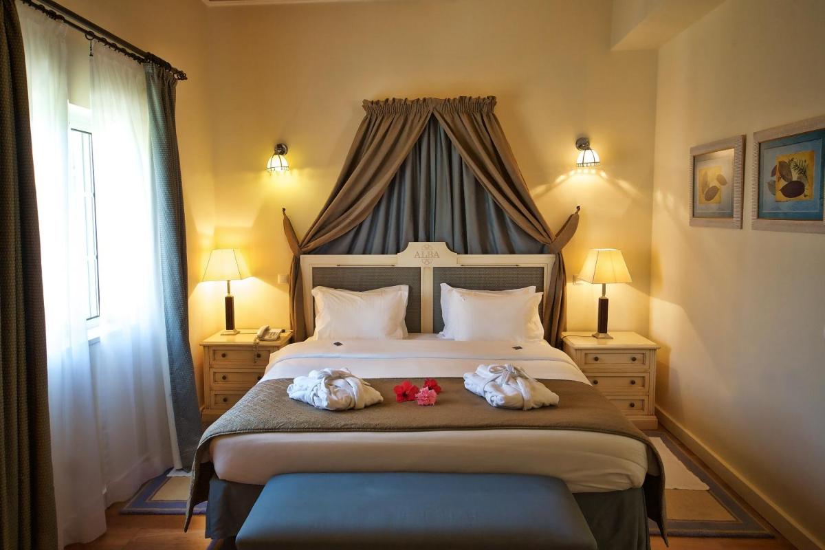 Uma cama ou camas num quarto em Vila Alba Resort