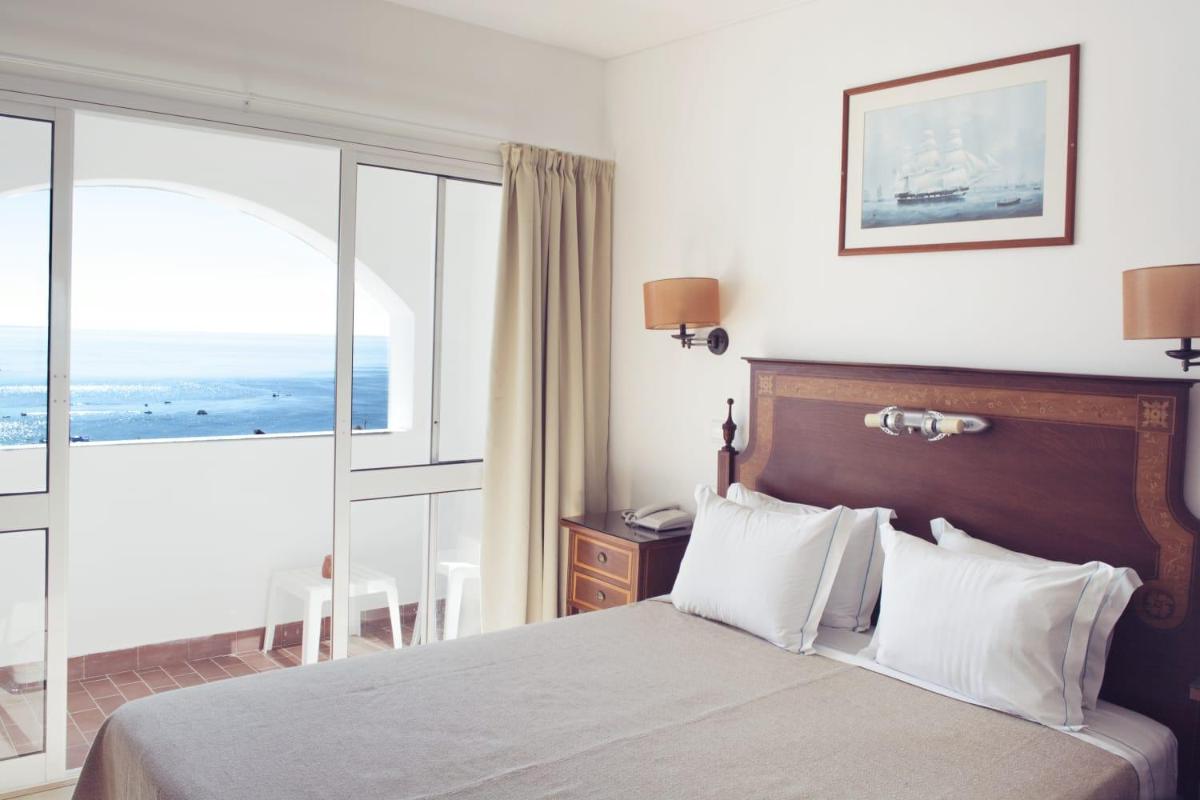 Uma cama ou camas num quarto em Hotel do Cerro