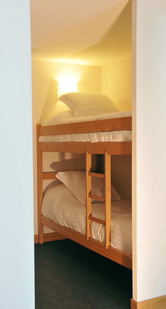 Un ou plusieurs lits dans un hébergement de l'établissement Best Western Premier Hôtel du Vieux-Port