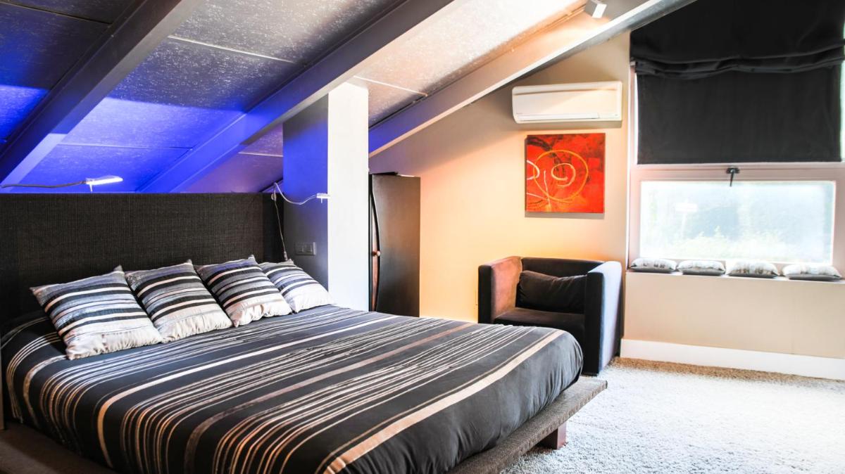 Cama o camas de una habitación en Hotel Cardamomo Sigüenza