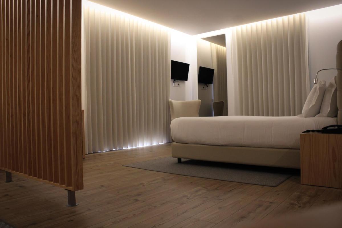 Uma cama ou camas num quarto em LAM Hotel Celorico de Basto