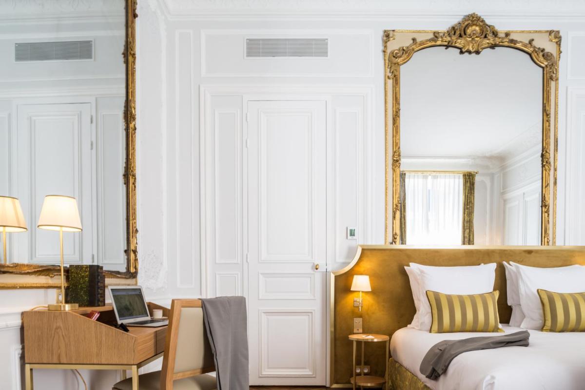 Un ou plusieurs lits dans un hébergement de l'établissement Hôtel Alfred Sommier