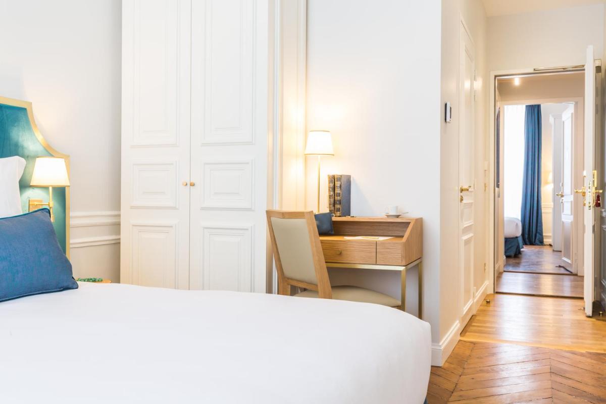 Un ou plusieurs lits dans un hébergement de l'établissement Hôtel Alfred Sommier