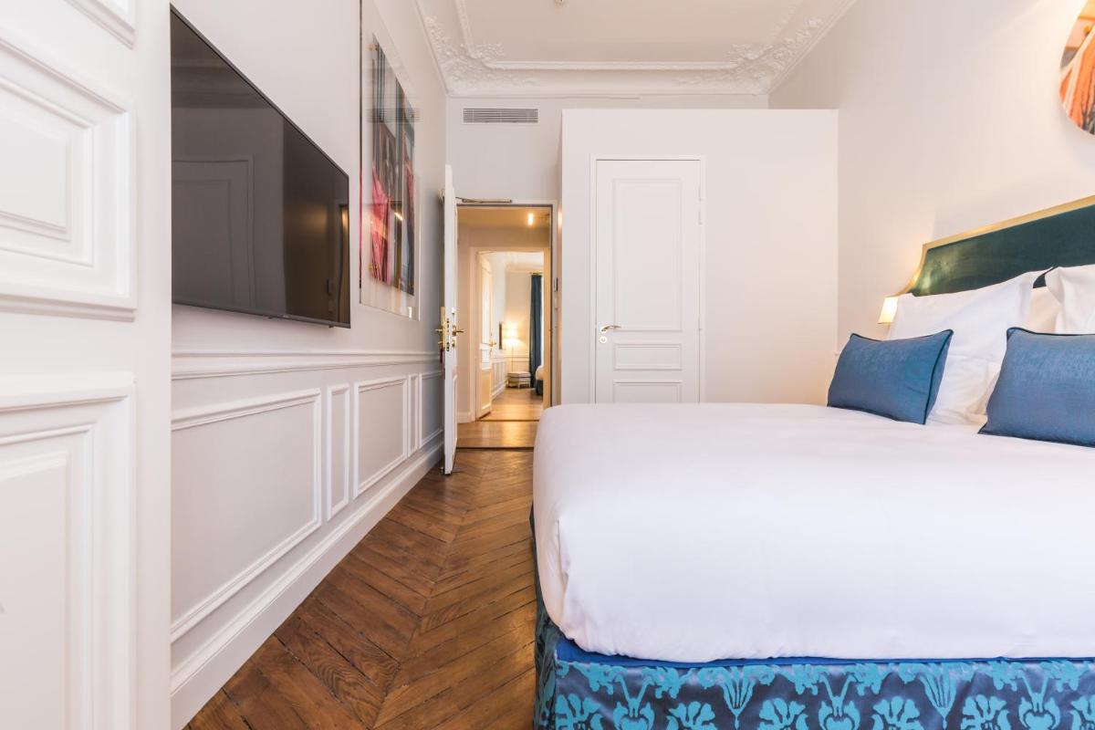 Un ou plusieurs lits dans un hébergement de l'établissement Hôtel Alfred Sommier