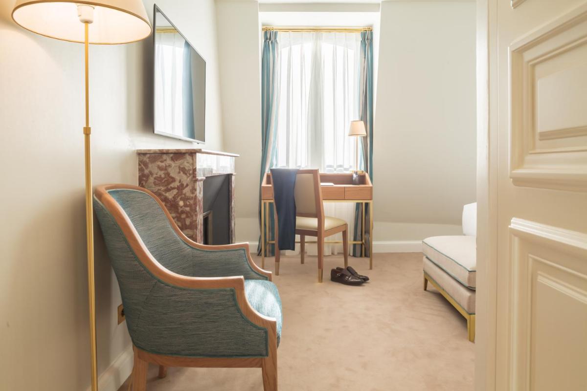 Un ou plusieurs lits dans un hébergement de l'établissement Hôtel Alfred Sommier