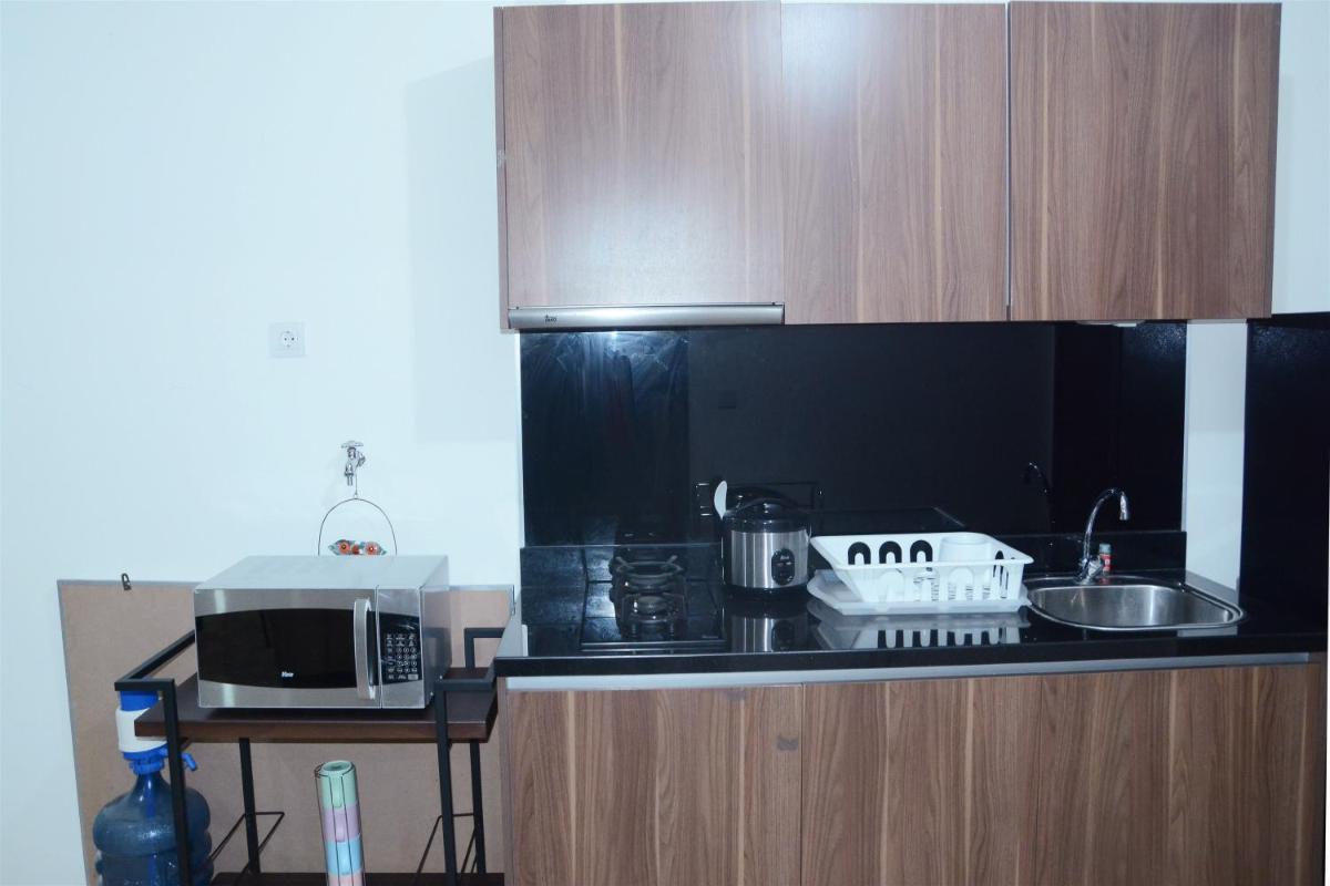 Comfy 1BR L'Avenue Apartment By Travelio - Housity