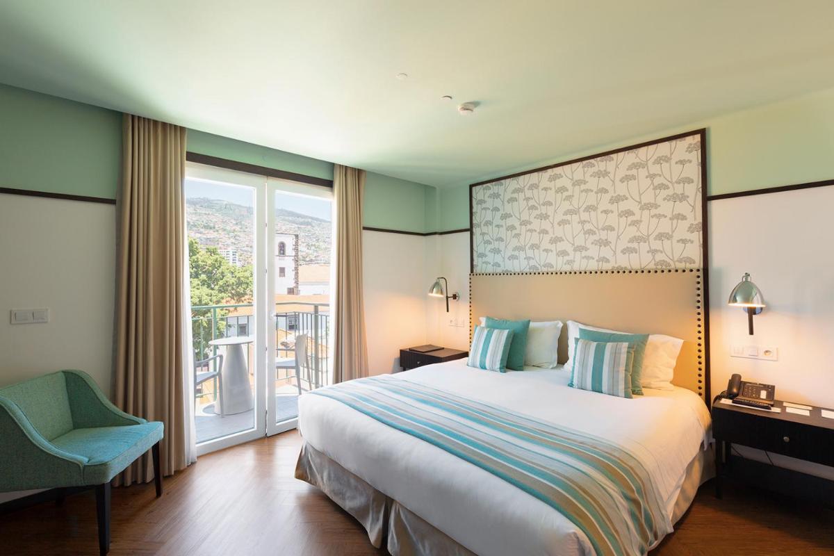 Uma cama ou camas num quarto em Castanheiro Boutique Hotel