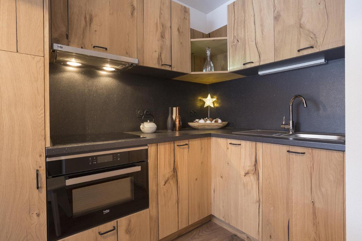 Cuisine ou kitchenette dans l'établissement Résidence Club MMV La Clé des Cimes