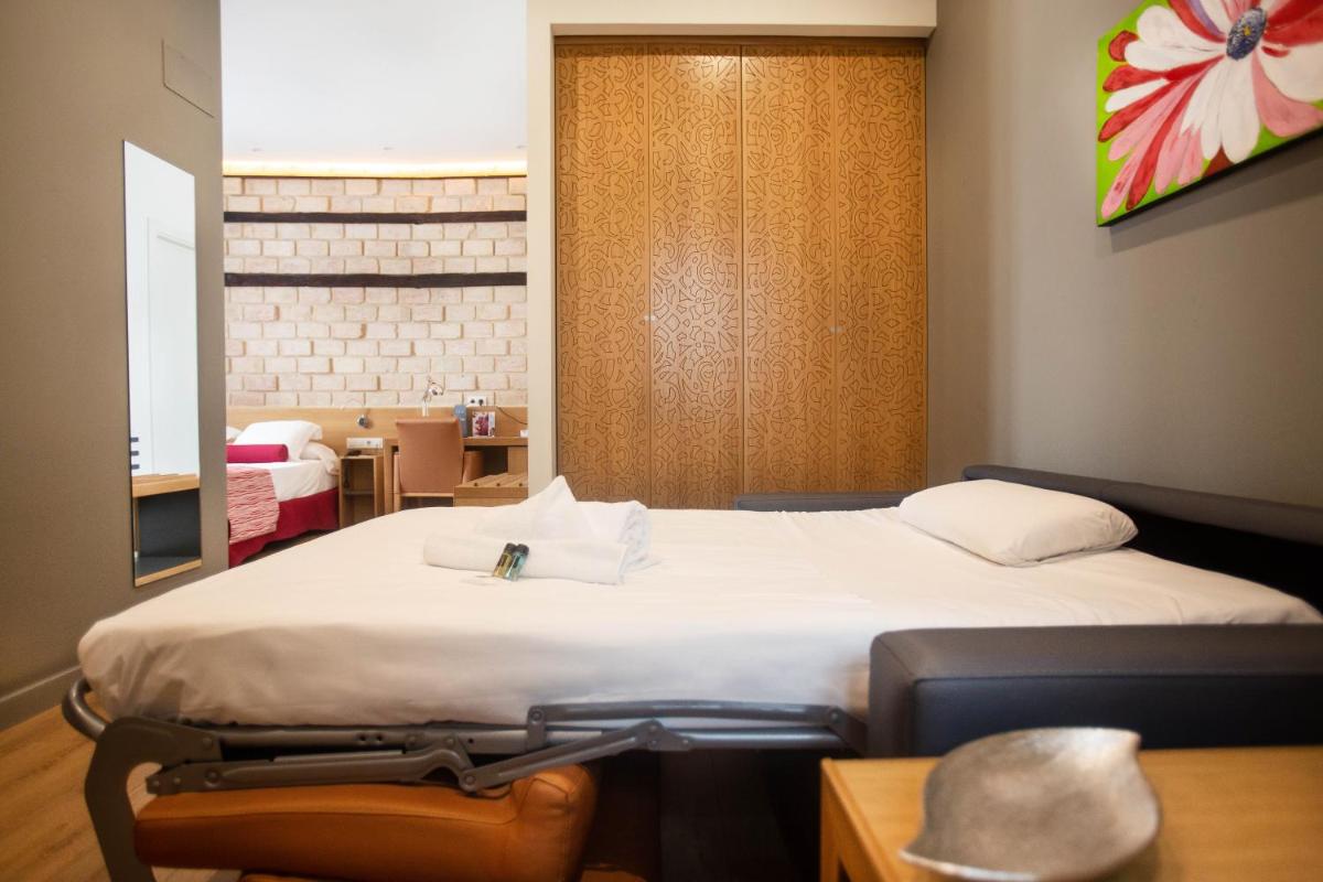Cama o camas de una habitación en Soho Boutique Capuchinos & Spa