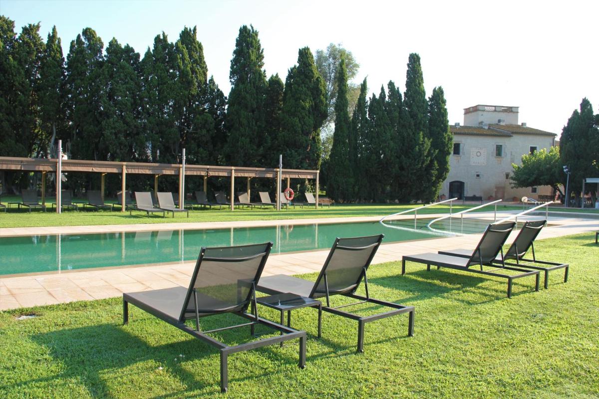 Piscina en o cerca de URH - Hotel Molí del Mig