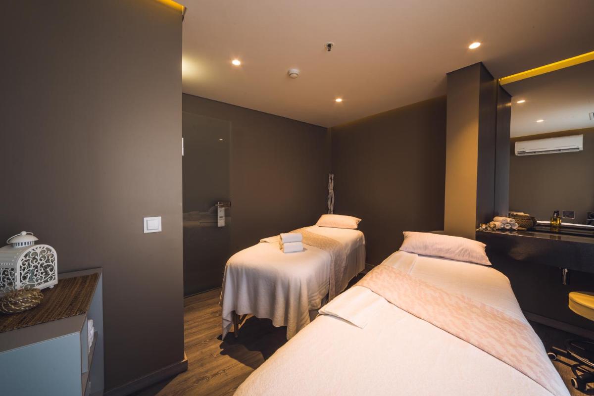 Uma cama ou camas num quarto em The Prime Energize Hotel & SPA - Algarve