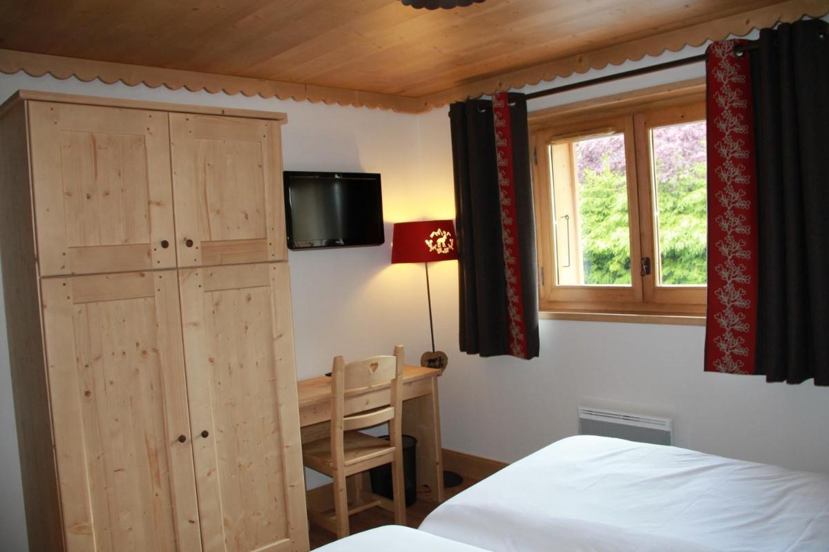 Un ou plusieurs lits dans un hébergement de l'établissement Les Chalets de La Griyotire