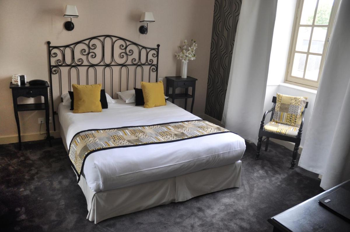 Un ou plusieurs lits dans un hébergement de l'établissement Hôtel 4 étoiles - Restaurants & Spa Périer Du Bignon