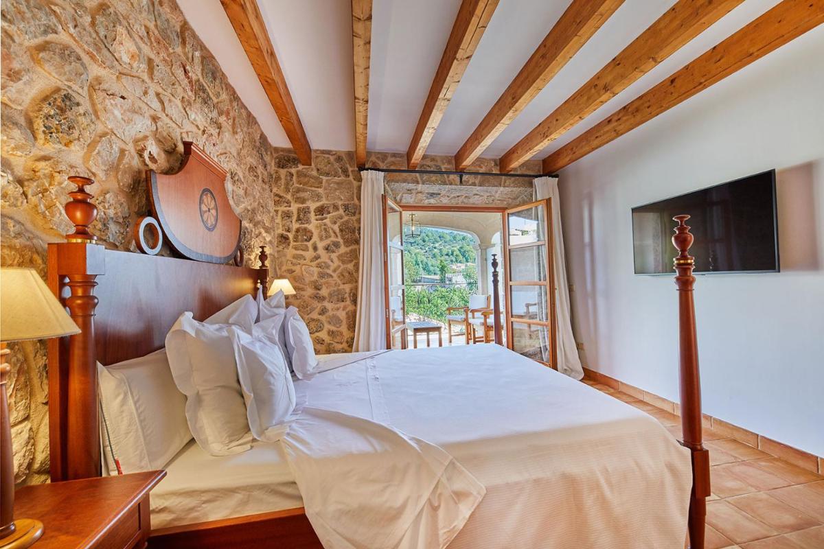 Cama o camas de una habitación en Cas Comte Suites & Spa - Adults Only