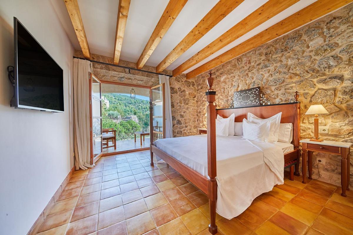 Cama o camas de una habitación en Cas Comte Suites & Spa - Adults Only