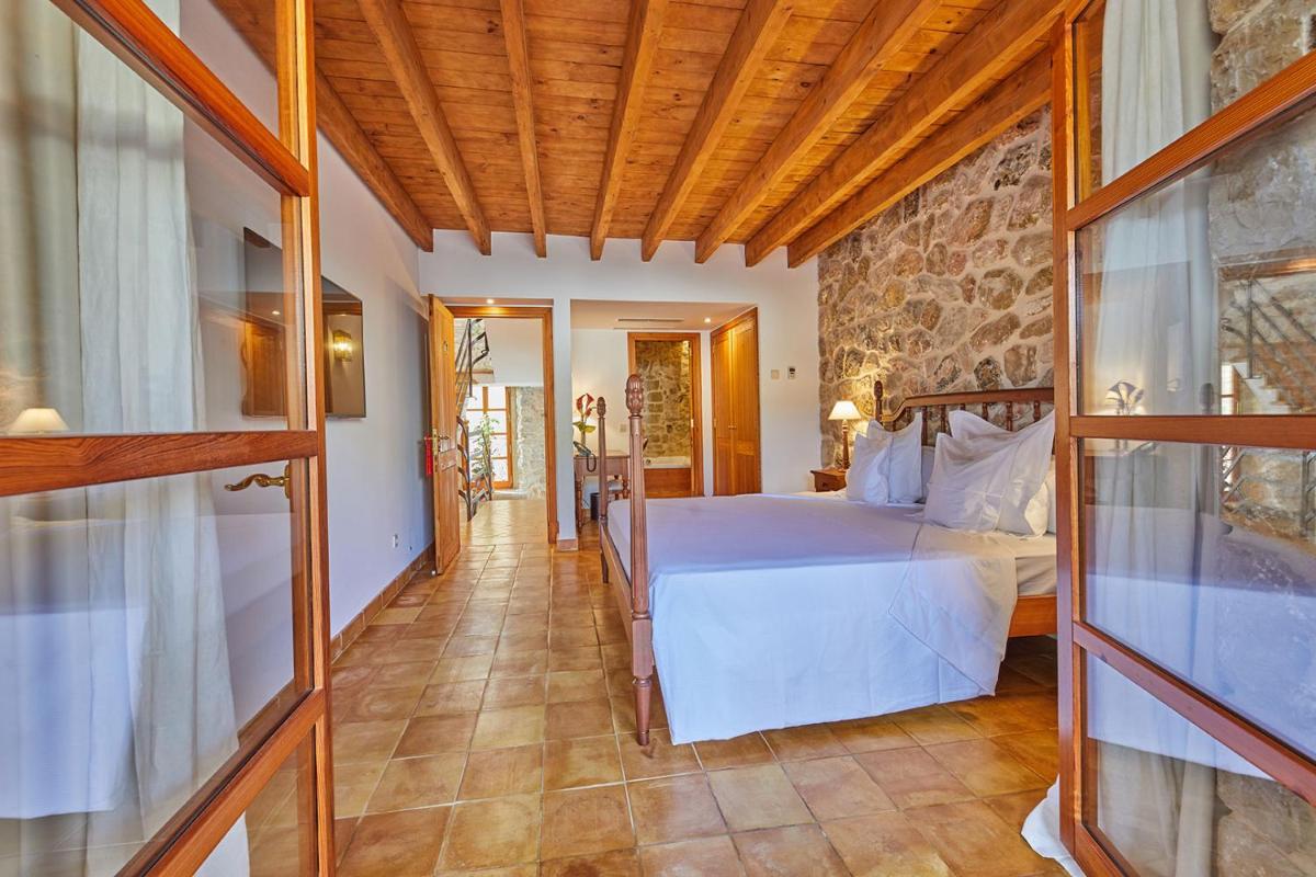 Cama o camas de una habitación en Cas Comte Suites & Spa - Adults Only