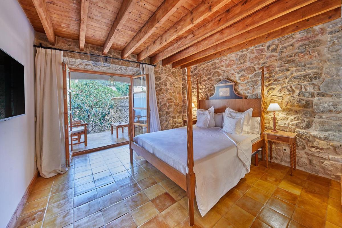 Cama o camas de una habitación en Cas Comte Suites & Spa - Adults Only