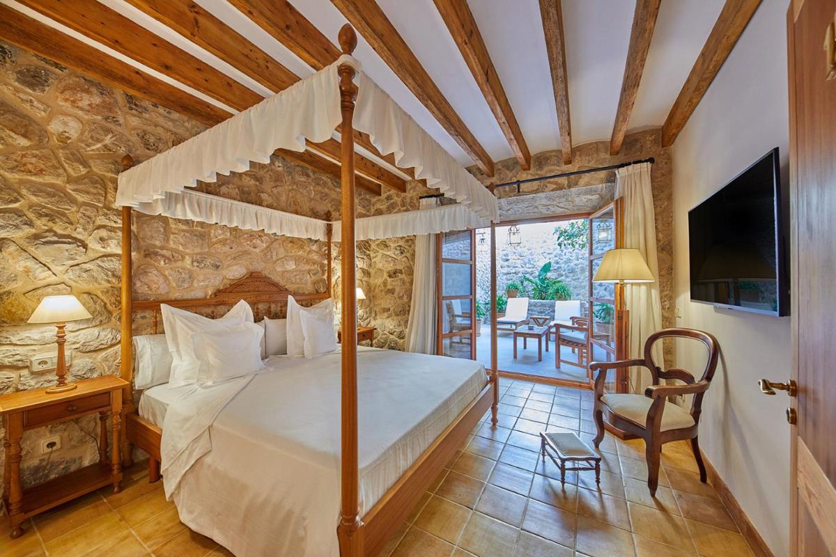 Cama o camas de una habitación en Cas Comte Suites & Spa - Adults Only