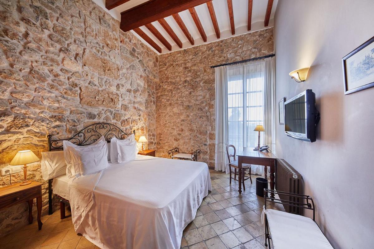 Cama o camas de una habitación en Cas Comte Suites & Spa - Adults Only