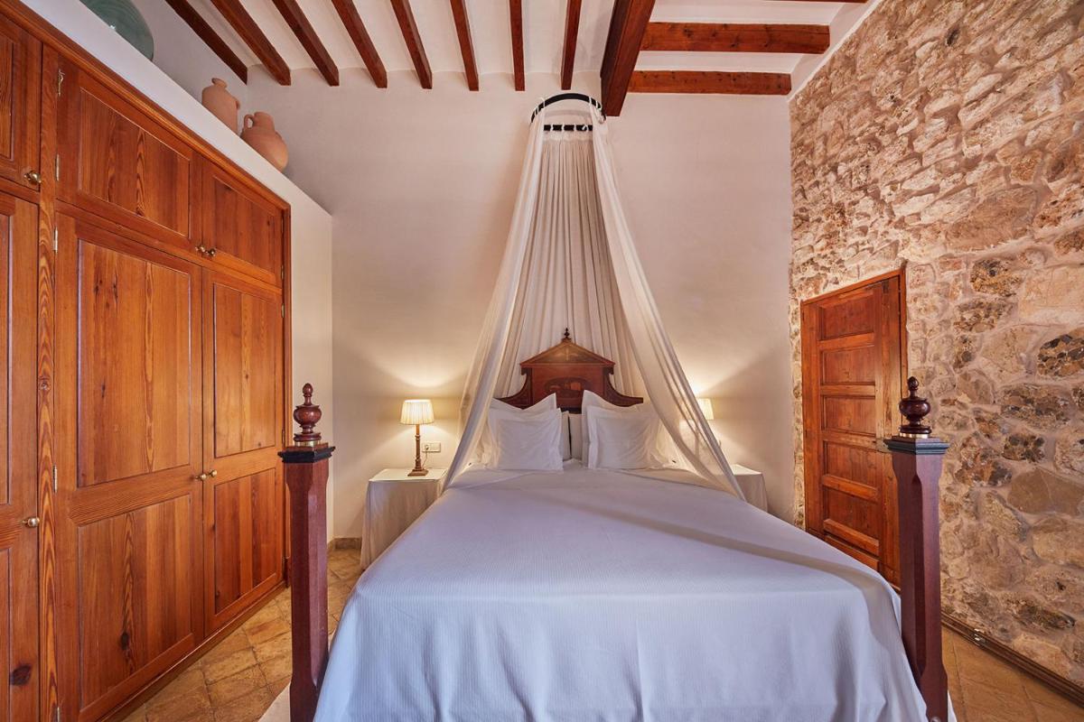 Cama o camas de una habitación en Cas Comte Suites & Spa - Adults Only