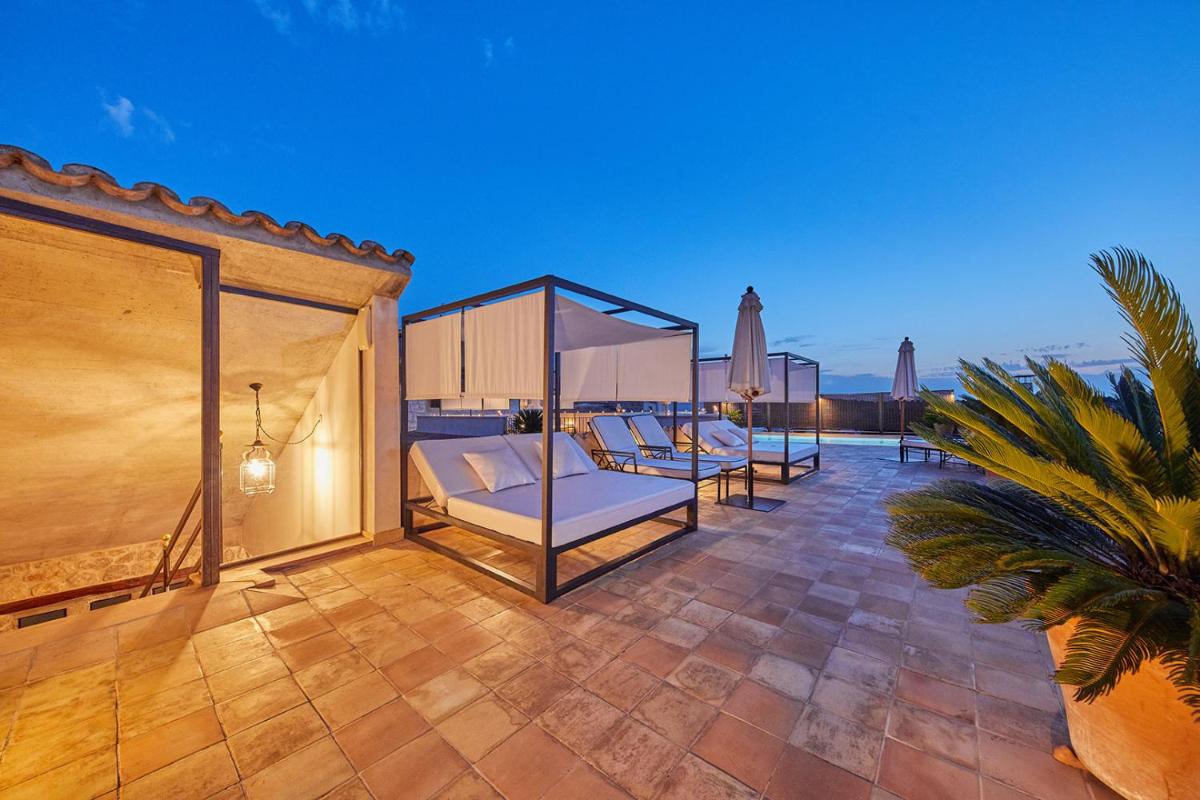 Cama o camas de una habitación en Cas Comte Suites & Spa - Adults Only