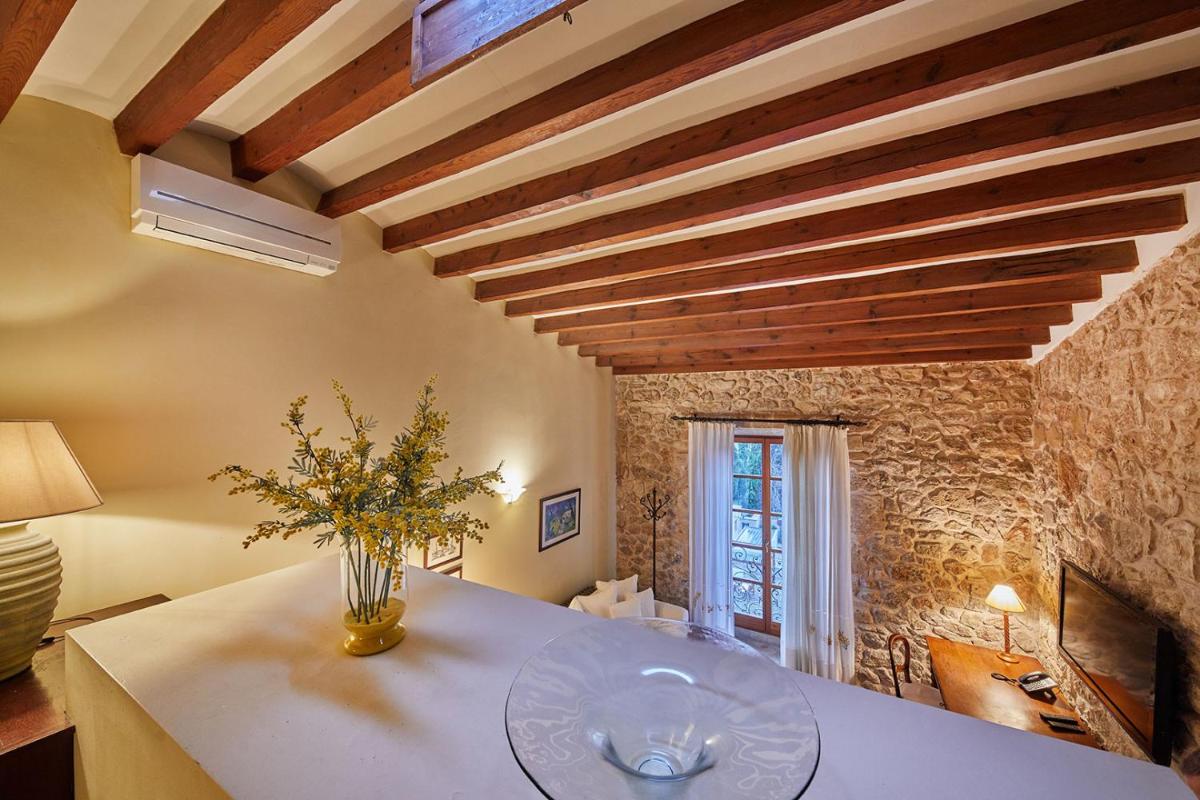 Cama o camas de una habitación en Cas Comte Suites & Spa - Adults Only