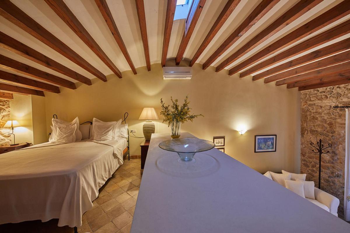 Cama o camas de una habitación en Cas Comte Suites & Spa - Adults Only