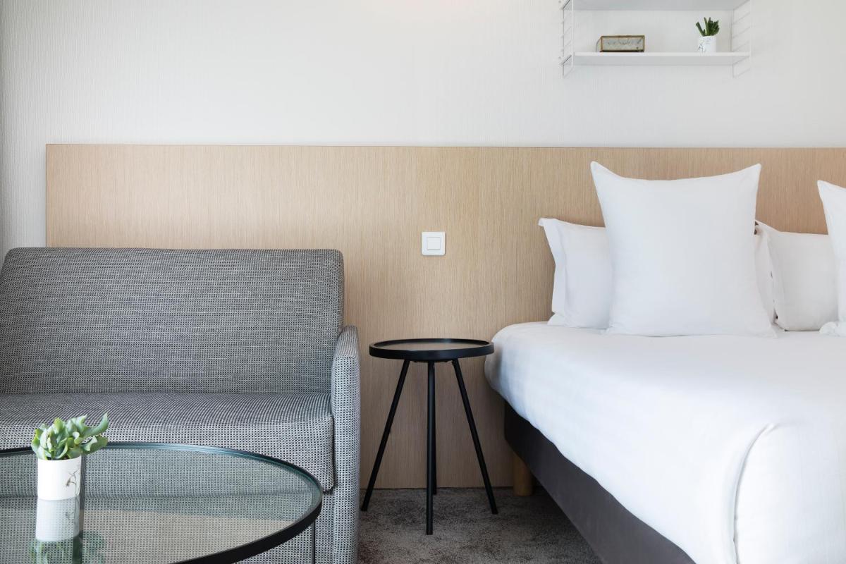 Un ou plusieurs lits dans un hébergement de l'établissement Best Western Plus Hotel les Rives du Ter