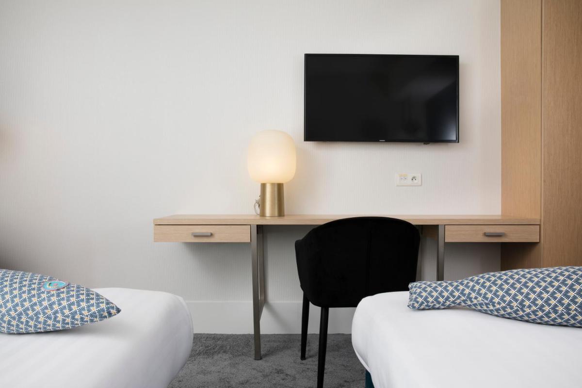 Télévision ou salle de divertissement dans l'établissement Best Western Plus Hotel les Rives du Ter